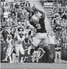  ?? Dustin Bradford, Getty Images ?? Colorado wide receiver K.D. Nixon bobbles a pass in overtime Saturday at Folsom Field.