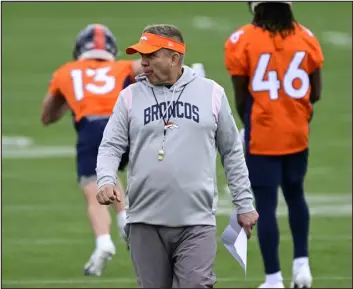  ?? ANDY CROSS — THE DENVER POST ?? Broncos head coach Sean Payton watches drills during rookie minicamp at the team training facility earlier this month.