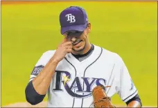  ?? Tony Gutierrez The Associated Press ?? Tampa Bay pitcher Charlie Morton didn’t fare well against the Dodgers Friday. He gave up seven hits and five runs in 4 1/3 innings in the 6-2 loss.