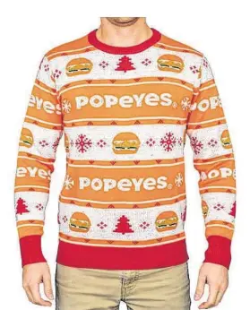  ?? Popeyes ?? Popeyes’ ugly chicken sandwich sweater is sure to put you in a holiday mood.