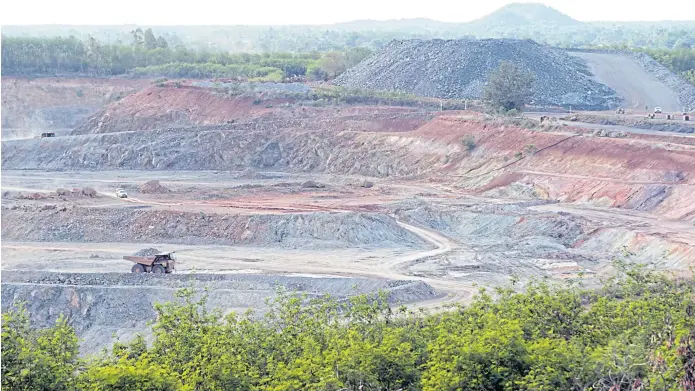  ??  ?? DIGGING DEEP: Akara has invested billions of baht in its gold mining operations, including this mine which covers vast areas in Phichit’s Thap Khlo district and Phetchabun’s Wang Pong district.