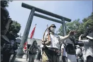  ?? THE ASSOCIATED PRESS ?? Visitors in Japanese Imperial army and navy uniforms enter Yasukuni Shrine, which honors Japan’s war dead, Saturday, Aug. 15, 2020, in Tokyo. Japan marked the 75th anniversar­y of the end of World War II.