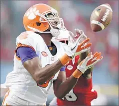  ?? Gerry Broome
Associated Press ?? CLEMSON, with receiver Deon Cain, tops the first College Football Playoff rankings, followed by LSU, Ohio State, and Alabama.