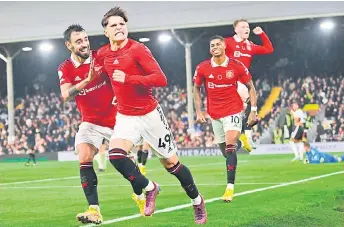  ?? — AFP photo ?? Garnacho (second left) celebrates with teammates after scoring his team’s second goal during the English Premier League match between Fulham and Manchester United at Craven Cottage in London.