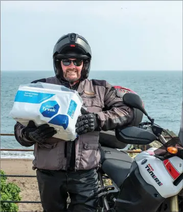  ??  ?? Brendan Farrell with a box of PPE ready for delivery