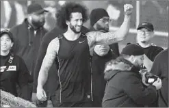  ?? CARMEN MANDATO/GETTY-AFP ?? Colin Kaepernick visits with fans following a workout Saturday in Riverdale, Ga.