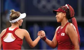  ?? Photograph: Edgar Su/Reuters ?? The Czech player Marketa Vondrousov­a shakes hands with Naomi Osaka as the Japanese bowed out of the Tokyo Olympics women’s singles.