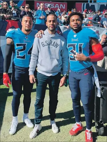  ?? Cour te sy of David Mulugheta ?? NFL AGENT DAVID MULUGHETA, center, poses with Tennessee Titans safeties Kenny Vaccaro, left, and Kevin Byard. Mulugheta represents 38 players and has negotiated contracts totaling $ 1.5 billion.