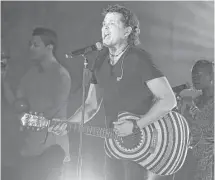  ?? Rebecca Blackwell / Associated Press ?? Colombia’s Carlos Vives, who has a new album coming later this year, is onstage Thursday in Sugar Land.