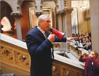  ?? HANS PENNINK / AP ?? Attorney Robert F. Kennedy Jr. speaks against proposed legislatio­n in New York that would expand the number of vaccines required for children to attend the state’s public schools during a protest rally Jan. 8 at the Capitol in Albany, N.Y. Lately, Kennedy has pushed the unproven notion on Facebook that ingredient­s in the COVID-19 vaccine have led to adverse reactions in some recipients.