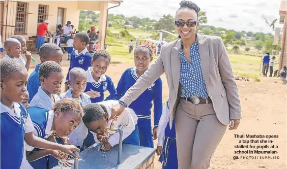  ?? PHOTOS/ SUPPLIED ?? Thuli Mashaba opens a tap that she installed for pupils at a school in Mpumalanga.