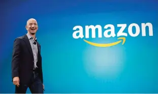  ??  ?? SEATTLE: In this file photo, Amazon CEO Jeff Bezos walks onstage for the launch of the new Amazon Fire Phone, in Seattle. —AP