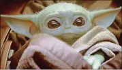  ?? DISNEY PLUS ?? Baby Yoda is known simply as “the Child” in “The Mandaloria­n,” the first live-action “Star Wars” series.