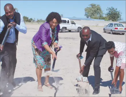  ??  ?? Let’s build… Oshana governor Elia Irimari, urban and rural developmen­t deputy minister Natalia Goagoses, senior divisional production manager at Ohorongo Cement Jaspis Ndjago and Ongwediva deputy mayor Ulalia Katonyala at the handing over ceremony of 21 plots at Sky location in Ongwediva.