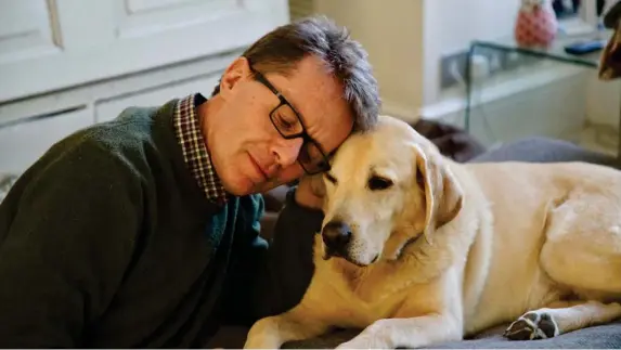  ?? (PA) ?? The TV and radio presenter with his golden labrador Maxwell