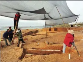  ??  ?? Archaeolog­ists of the all-female team work at an excavation site in Hechuan district of Chongqing in March last year.