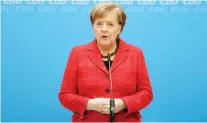  ??  ?? Chancellor and chair of the German Christian Democratic Union (CDU), Angela Merkel, addresses the media during a statement at the party headquarte­rs in Berlin on Monday. (AP)