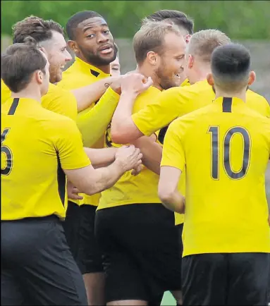  ?? Picture: Paul Amos FM19222781 ?? Tom Scorer congratula­ted after netting his and Kennington’s second goal during Sunday’s 4-2 FA Vase win against Crowboroug­h. Ton have been drawn at home to Southern Combinatio­n Premier Division side Newhaven in the second round. The tie will be played at Homelands on Saturday, November 2 (3pm). Match report, page 42