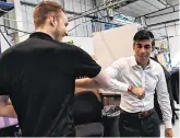  ??  ?? Recession: Chancellor Rishi Sunak bumps elbows with Scottish worker