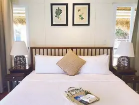  ??  ?? Fresh and bright: The interior of the water cottage, designed by Conrad Onglao, features abaca, solihiya weave, and a sustainabl­e welcome gift.