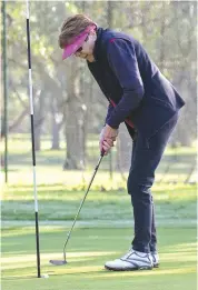  ??  ?? Gail Franklin of Bunyip completes the fifth hole in fantastic sunshine.