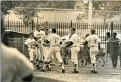  ?? CONTRIBUTE­D PHOTO — HACKENSACK HIGH SCHOOL ?? The author (No. 1) is congratula­ted by his high school teammates after a solo home run. He and teammate Art Sarro hit back-to-back dingers to boost their team to a 2-0lead en route to a 4-1victory to give them the league championsh­ip.