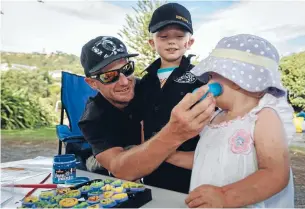  ?? Photo: VIRGINIA WOOLF/FAIRFAX NZ ?? Shannon Proctor, left, 4-year-old Ashton, and 2-year-old Tara attend The Active Dads group Treasure Hunt at Tahunanui Beach playground, Nelson.