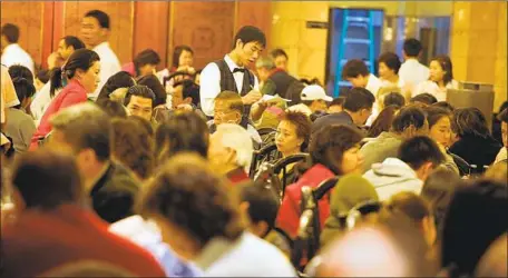  ?? Gary Friedman Los Angeles Times ?? CUSTOMERS PACK Ocean Star Restaurant in Monterey Park in 2006. The dim sum hall, which opened in 1982, abruptly closed May 1.