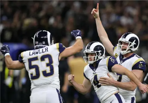  ?? Photos by Jonathan Bachman/Getty Images ?? The Rams’ Greg Zuerlein celebrates after kicking the game-winning field goal in overtime to beat the Saints, 26-23, in the NFC championsh­ip game Sunday at the Mercedes-Benz Superdome in New Orleans.
