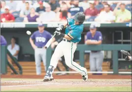  ?? PHOTO BY COASTAL CAROLINA ATHLETICS ?? Coastal Carolina’s Tyler Chadwick hits a solo home run in the team’s June 25 game against TCU during the College World Series in Omaha. Chadwick, the son of former Lackey head football coach Scott Chadwick, started at second base during each of the...