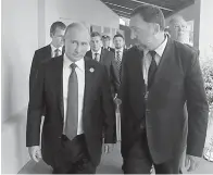  ?? Mikhail Klimentyev, Sputnik, Kremlin Pool Photo via AP, File ?? ■ This Nov. 10, 2017, file photo shows Russia’s President Vladimir Putin, left, and Russian metals magnate Oleg Deripaska, right, walking to attend the APEC Business Advisory Council dialogue in Danang, Vietnam.