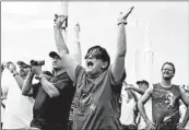  ?? JULIE FLETCHER/AP ?? Vanessa Fabrega cheers as she watches the launch of space shuttle Atlantis in 2011 in Cape Canaveral, Fla.