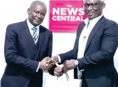  ?? ?? L-R: John Enoh, Minister of Sports Developmen­t and Kayode Akintemi, managing director of News Central TV during the minister’s visit to News Central office recently.