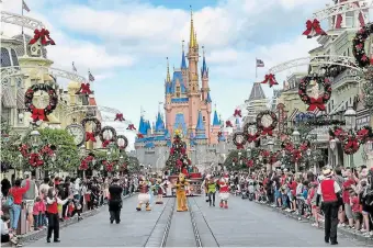  ?? JOE BURBANK TRIBUNE NEWS SERVICE FILE PHOTO ?? Both Disney and Florida seem to be out of touch with the public, whether through high prices or a law that discrimina­tes against the LGBTQ community, Katie Greenan and Hallie Gallinat write.