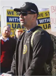  ?? STAFF PHOTO BY OLIVIA ROSS ?? In 2023, Isaac Meadows, a Volkswagen worker in favor of the UAW, speaks to the media.