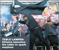  ??  ?? TABLE LAMPED: Chisora launches the table to spark mayhem