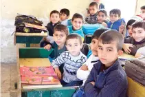  ??  ?? Iraqi children in a classroom in the battered city of Mosul. (AFP)