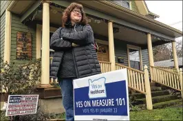  ?? GILLIAN FLACCUS / ASSOCIATED PRESS ?? Portland resident Kelly Burke has volunteere­d at a pro-Measure 101 phone bank. She briefly lost her insurance years ago when she was pregnant with her second child. She now has a serious auto-immune disease and is thankful she has insurance through her...