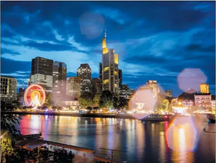  ?? MICHAEL PROBST — THE ASSOCIATED PRESS ?? Raindrops on the camera lens reflect the lights of the Mainfest event at the river Main in Frankfurt, Germany, late Friday.