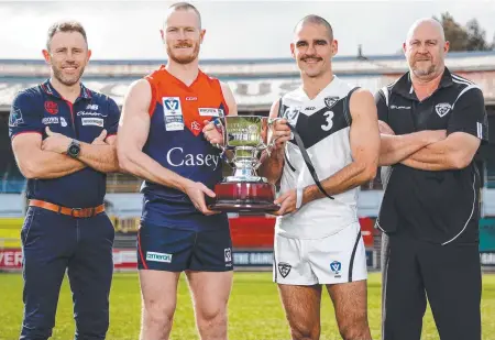  ?? ?? Casey Demons coach Mark Corrigan, left, and captain Mitch White and Southport Sharks captain Jacob Dawson and coach Steve Daniel at Ikon Park on Monday; and Dawson (inset) accepting the 2022 Rebel Coaches MVP Smithys VFL Award during the 2022 VFL & VFLW Awards Night at Crown Casino, Melbourne. Main photo: Dylan Burns/Getty