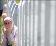  ?? AP PHOTO ?? A Bosnian Muslim woman prays among gravestone­s during a funeral ceremony for dozens of newly identified victims of the 1995 massacre, at the memorial centre of Potocari near Srebrenica, 150 kms north east of Sarajevo, Bosnia, Tuesday.