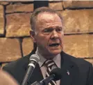  ??  ?? Senate candidate Roy Moore, here speaking during Veterans Day event Saturday, has denied any sexual misconduct. WES FRAZER/GETTY IMAGES