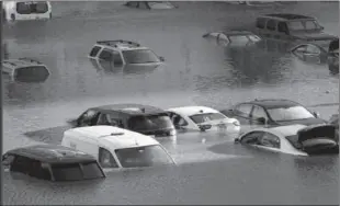  ??  ?? PHILADELPH­IA
Vehicles are under water during flooding in Philadelph­ia in the aftermath of downpours and high winds from the remnants of Hurricane Ida that hit the area. -AP