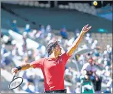  ?? AFP ?? Roger Federer serves against Uzbekistan's Denis Istomin during their French Open first-round match on Monday.