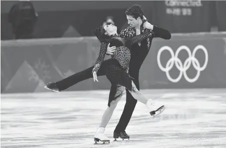  ?? MLADEN ANTONOV/AFP/GETTY IMAGES ?? Tessa Virtue of London, Ont., and Scott Moir of Ilderton, Ont., are wrapping up their Olympic career at the Pyeongchan­g 2018 Winter Games. The duo are hoping to cap their 20-year competitiv­e careers with a gold medal in the ice dance on Tuesday.