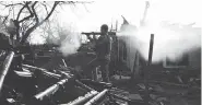  ??  ?? A Ukrainian serviceman fires a grenade launcher during fighting with pro-Russian separatist­s in March. Despite an armistice, the war of attrition has been growing.