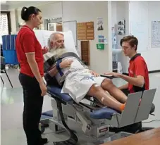  ??  ?? STRENGTHEN: Participat­ing in an exercise are (from left) Allied Health Assistant Lauren Knight, Leon McGarry and Student Callum Stinson.