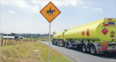  ?? PHOTOS:CAMERON BURNELL/FAIRFAX NZ ?? Idyll spoilt: Large tankers are commonplac­e in rural Tikorangi. Below: Tikorangi School principal Paul Johnson is concerned for his pupils’ safety.