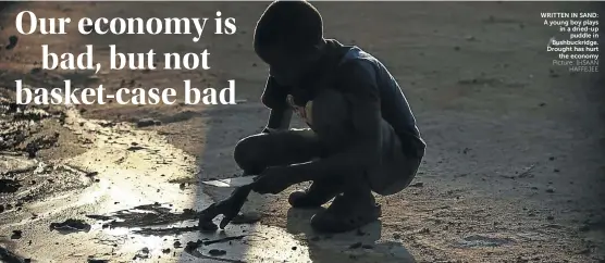  ?? Picture: IHSAAN
HAFFEJEE ?? WRITTEN IN SAND: A young boy plays in a dried-up
puddle in Bushbuckri­dge. Drought has hurt
the economy