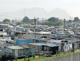  ??  ?? Road to nowhere: A picture taken in 1995 shows an informal settlement along the N2 highway in Cape Town. More than 20 years later, such settlement­s are growing all over the metro area.